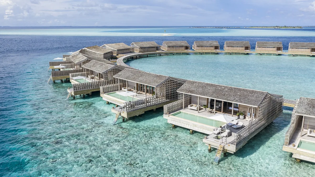 Aerial view of overwater villas at a Maldives resort