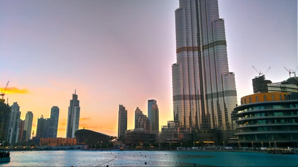 Burj Khalifa and the Dubai Fountain lake at dusk