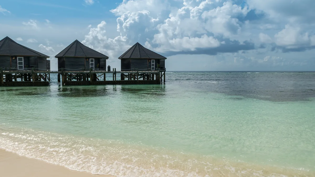 Overwater villas above a lagoon in the Maldives