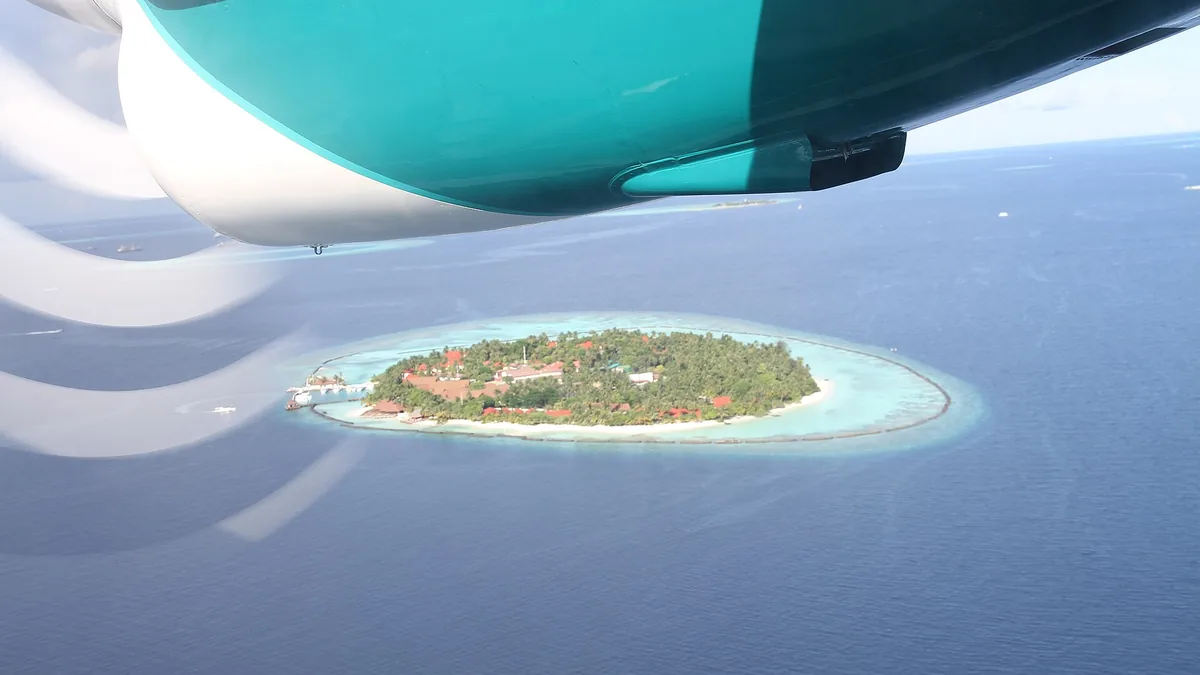 Resort island in the Maldives seen from a seaplane